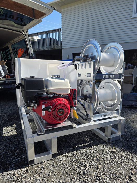 Honda-powered pressure washing skid with twin aluminium hose reels with stainless internals and tank, built by Softwash Source